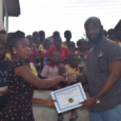 A teacher receiving her certificate